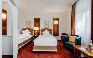 Postel nebo postele na pokoji v ubytování Romantik Hotel Gebhards