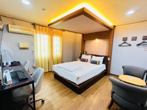 Postel nebo postele na pokoji v ubytování Sweet Hotel