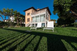 A garden outside Ca' delle Contesse - Villa on lagoon with private dock and spectacular view