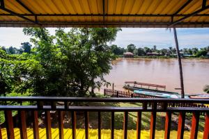 a view of a river with boats on it at Bontai Resort, Don Khon in Ban Khon