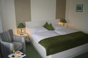 Säng eller sängar i ett rum på Hotel Christine