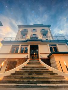 a building with stairs leading up to a building at Hotel La Verticale in Chamonix