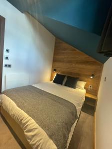 Postel nebo postele na pokoji v ubytování Hotel La Verticale