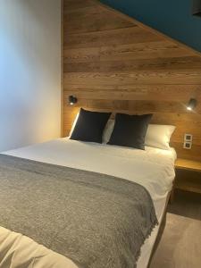 Postel nebo postele na pokoji v ubytování Hotel La Verticale