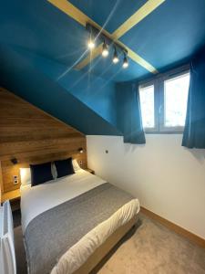 Postel nebo postele na pokoji v ubytování Hotel La Verticale