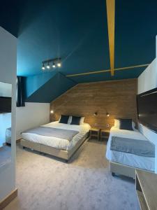 Postel nebo postele na pokoji v ubytování Hotel La Verticale