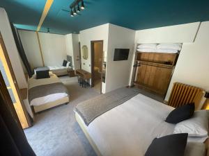 Postel nebo postele na pokoji v ubytování Hotel La Verticale