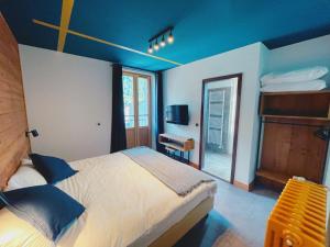 Postel nebo postele na pokoji v ubytování Hotel La Verticale