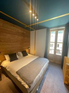 Postel nebo postele na pokoji v ubytování Hotel La Verticale