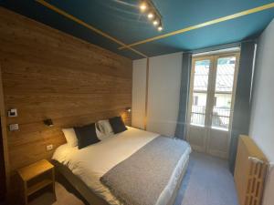 Postel nebo postele na pokoji v ubytování Hotel La Verticale