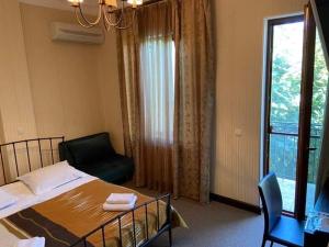 Postel nebo postele na pokoji v ubytování Dzveli Ubani
