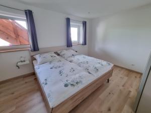 Postel nebo postele na pokoji v ubytování Beim Risei