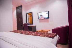 Havilah Towers Hotel Ltd客房内的一张或多张床位
