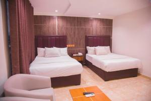 Havilah Towers Hotel Ltd客房内的一张或多张床位