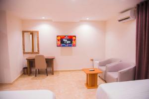 Havilah Towers Hotel Ltd客房内的一张或多张床位