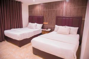 Havilah Towers Hotel Ltd客房内的一张或多张床位