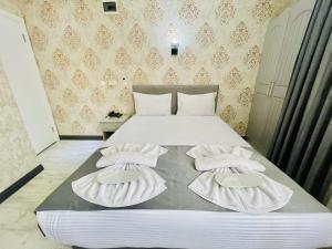 a bedroom with a bed with two towels on it at Old City Viva Hotel in Istanbul