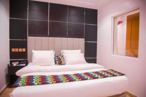 Havilah Towers Hotel Ltd客房内的一张或多张床位