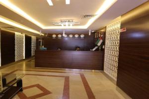 a lobby with a reception desk in a building at OYO 912 Tanha Hotel in Dubai