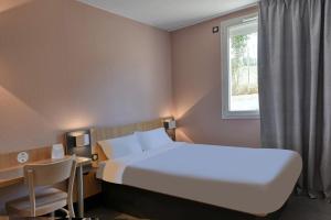 Postel nebo postele na pokoji v ubytování B&B HOTEL Brive-la-Gaillarde