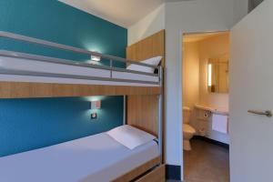 Postel nebo postele na pokoji v ubytování B&B HOTEL Brive-la-Gaillarde