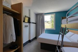 Postel nebo postele na pokoji v ubytování B&B HOTEL Brive-la-Gaillarde
