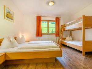 a bedroom with two bunk beds and a window at Group Apartment in Stubaital with Ski Storage in Neustift im Stubaital