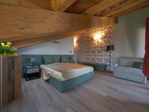 Łóżko lub łóżka w pokoju w obiekcie Relais Colle Messino Briaglia Mondovì