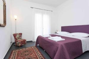 A bed or beds in a room at Guascone Apartments Még 25 kép