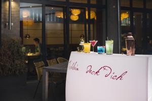 a table with a sign on it in front of a restaurant at Grimm's Potsdamer Platz in Berlin
