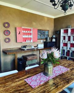 a kitchen with a table with flowers on a counter at La Luna @ Misty Mountains in Studholme