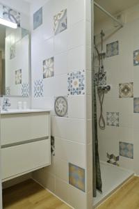 a bathroom with a shower and a sink at Résidence Easy Lodge in Ajaccio