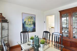a dining room with a glass table and chairs at Balcon del Mar MG by VillaGranCanaria in Arguineguín +32 photos