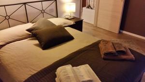 Voodi või voodid majutusasutuse B&B Aria d'Argento & Relax Home toas