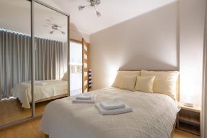 Posteľ alebo postele v izbe v ubytovaní Apartament Plaża