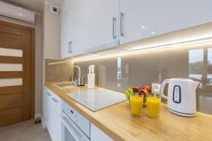 Kuchyňa alebo kuchynka v ubytovaní Apartament Plaża