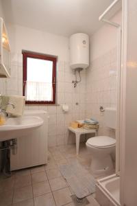 Kúpeľňa v ubytovaní Apartment Fazana 7284c