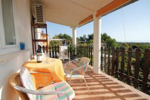 a patio with a table and chairs on a balcony at Apartments with a parking space Liznjan, Medulin - 7224 in Ližnjan