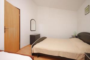 Ένα ή περισσότερα κρεβάτια σε δωμάτιο στο Apartments with a parking space Liznjan, Medulin - 7214