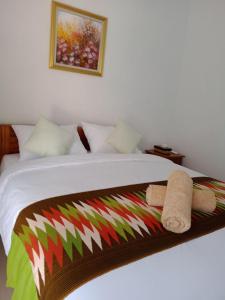 Postel nebo postele na pokoji v ubytování Gedhong Hostel