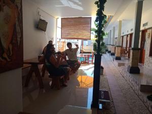 a group of people sitting in a room at Gedhong Hostel in Nusa Penida