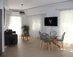 Televízia a/alebo spoločenská miestnosť v ubytovaní Ventiri Family Suite 1
