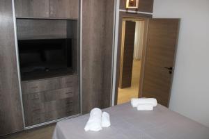 Posteľ alebo postele v izbe v ubytovaní Ventiri Family Suite 1