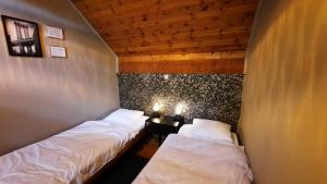 Postel nebo postele na pokoji v ubytování Gîte rural Hubermont & Merveilles