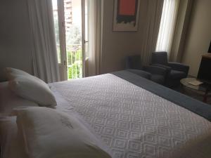 A bed or beds in a room at Gran Hotel Albacete