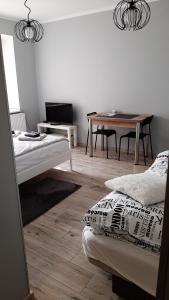 Posteľ alebo postele v izbe v ubytovaní Apartament Kilińskiego