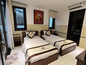 Postel nebo postele na pokoji v ubytování Ngo House Villa