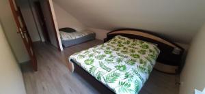 Posteľ alebo postele v izbe v ubytovaní Apartament Zacisze