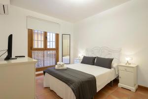 Posteľ alebo postele v izbe v ubytovaní Apartamento Concepción Granada Centro