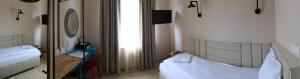 Postel nebo postele na pokoji v ubytování Hotel MEDITERRANEO